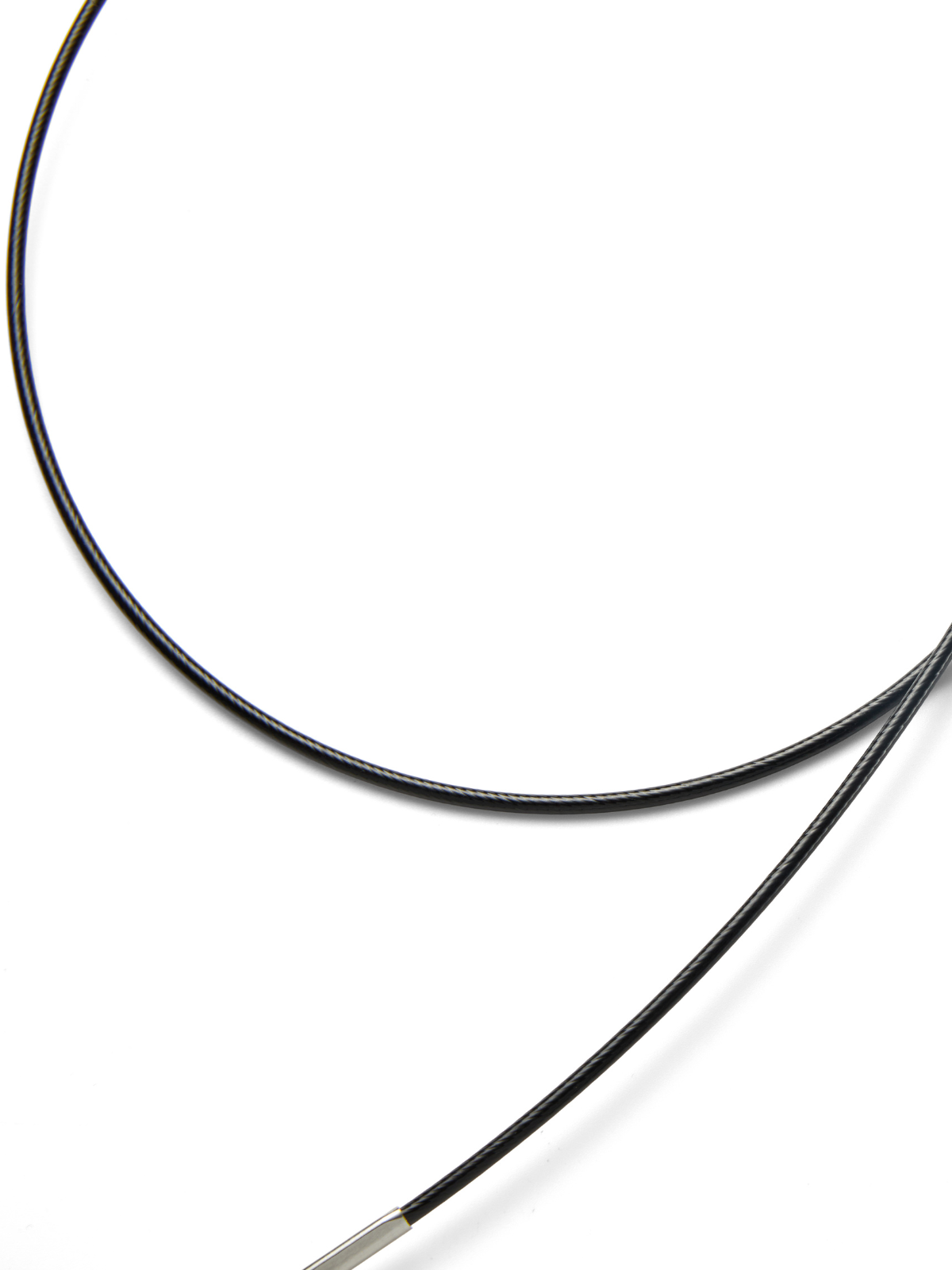 Close-up of a black cable on a white background
