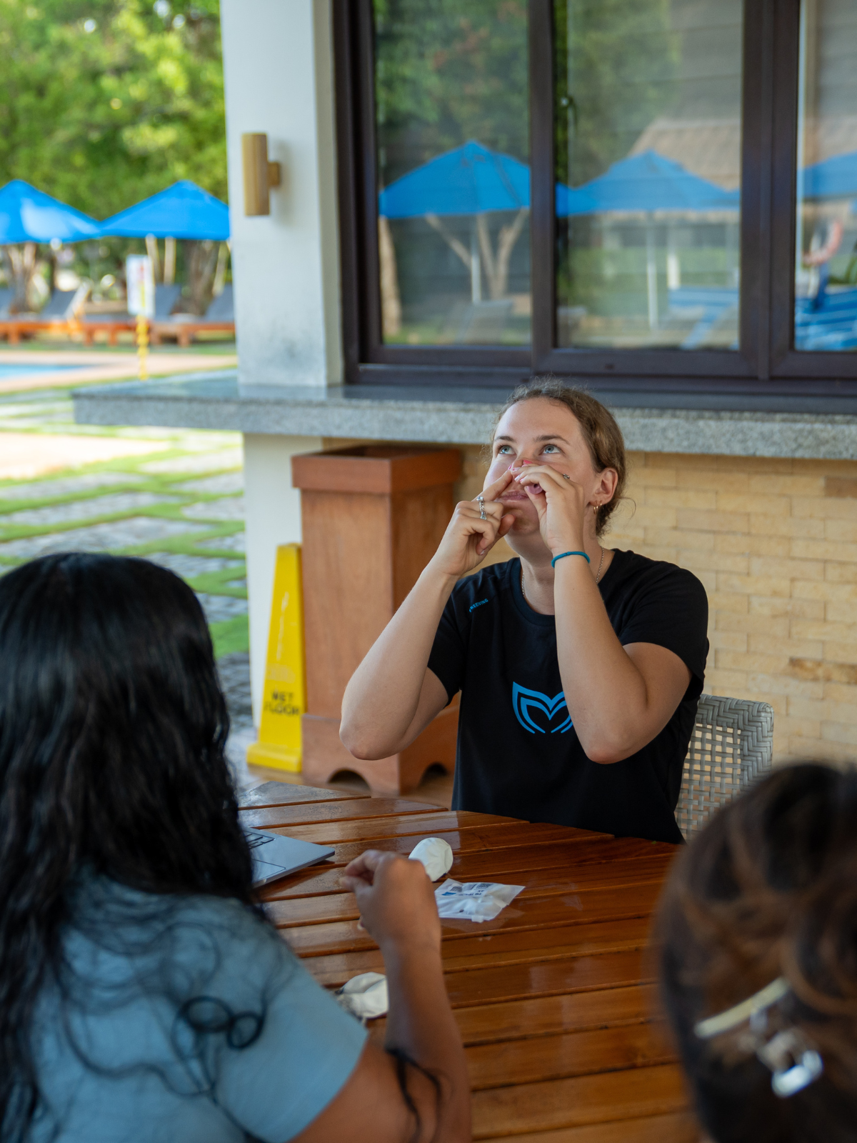 Molchanovs freediving instructor demonstrating Frenzel equalization technique to students during a dry land class