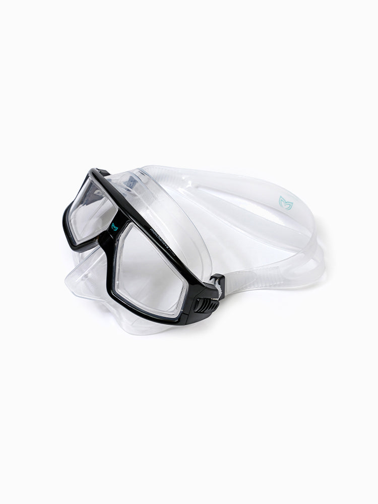 Molchanovs CORE freediving dive mask, black frame with clear silicone skirt, angled side view