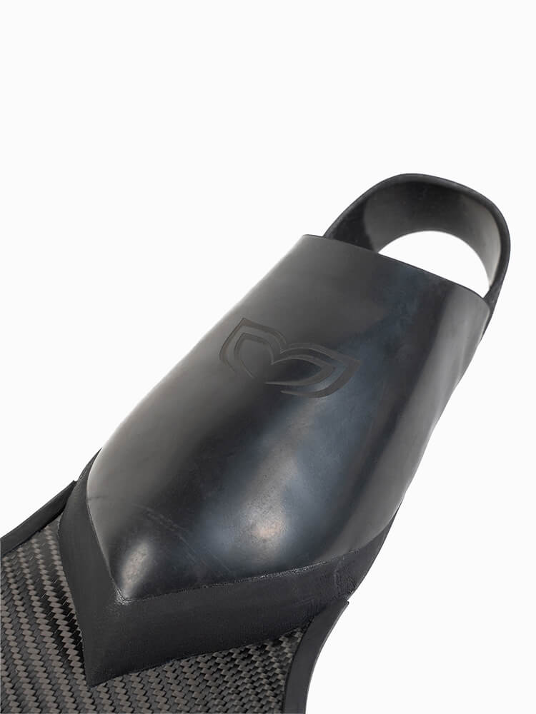 Close-up of the Molchanovs PRO Short Bifins 3 Carbon rubber foot pocket showing the embossed Molchanovs logo and carbon blade connection