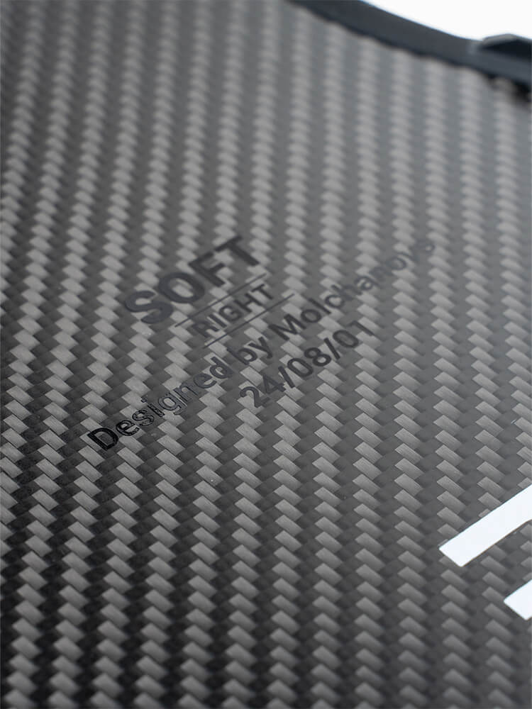 Close-up of PRO Short Bifins 3 Carbon blade showing engraved stiffness label reading SOFT RIGHT, Designed by Molchanovs, dated 24/08/01