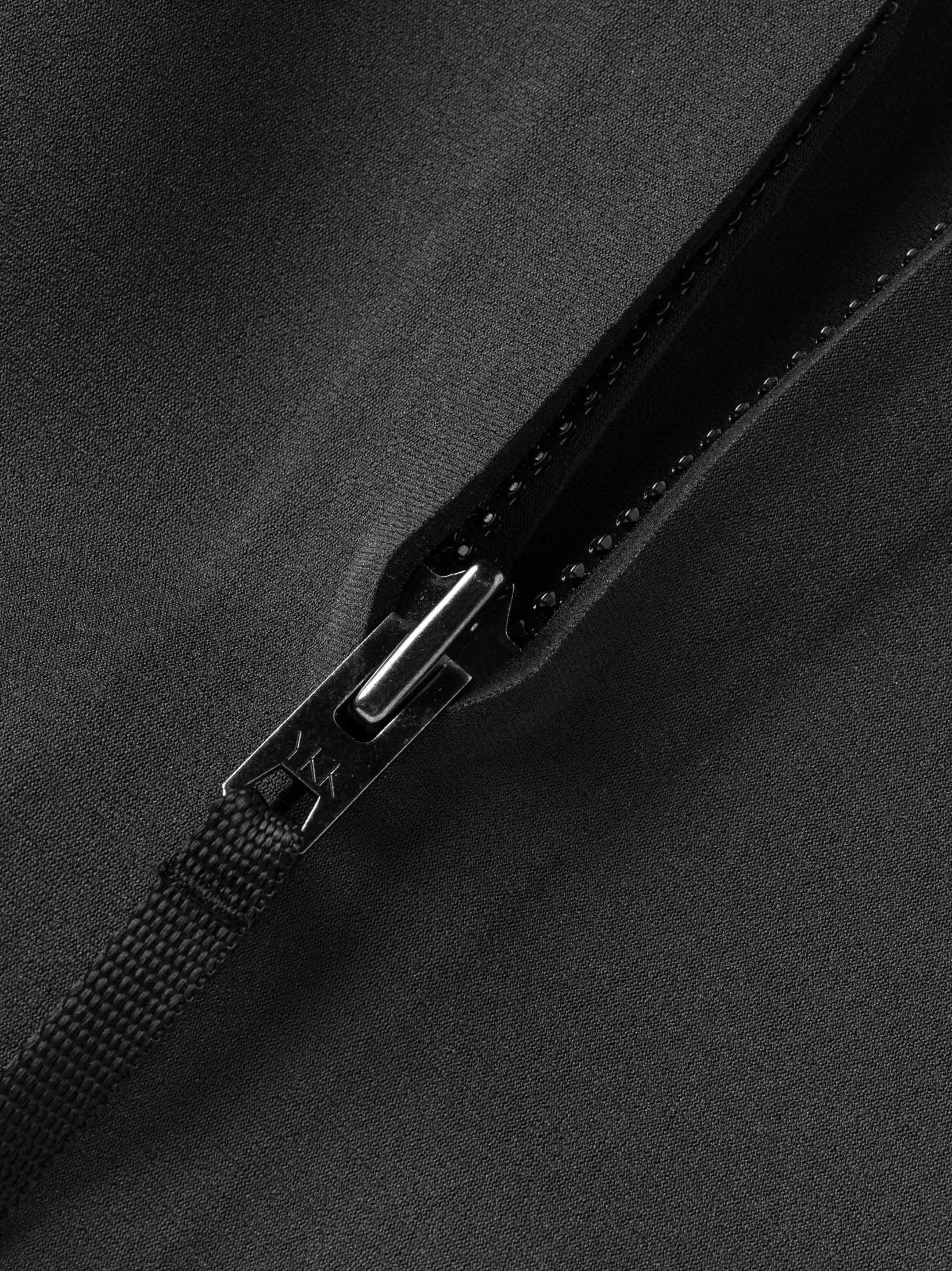 Close up of the quality zipper on this mens wetsuit