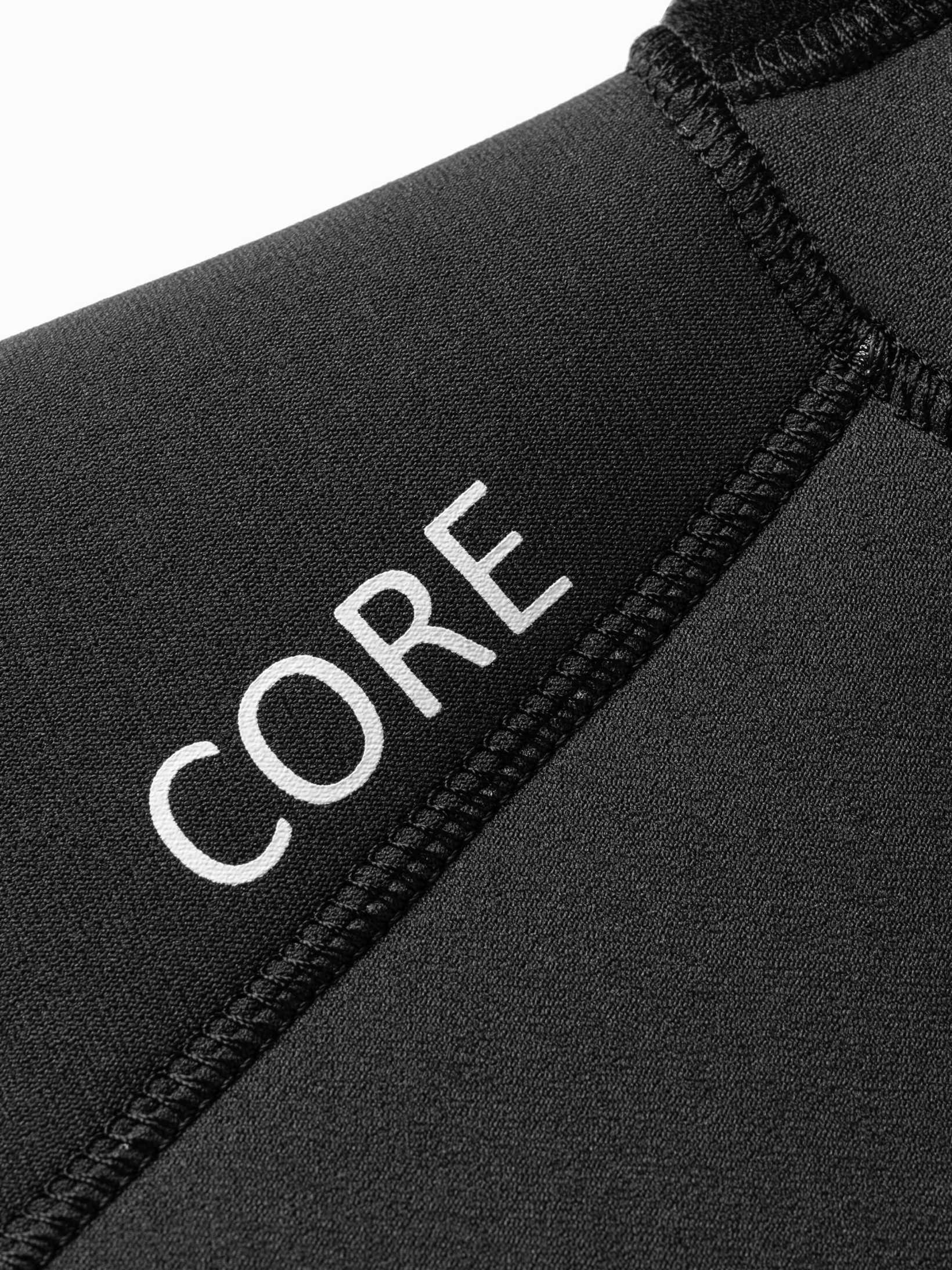 Close up of the CORE logo on the shoulder of the womens one piece wetsuit