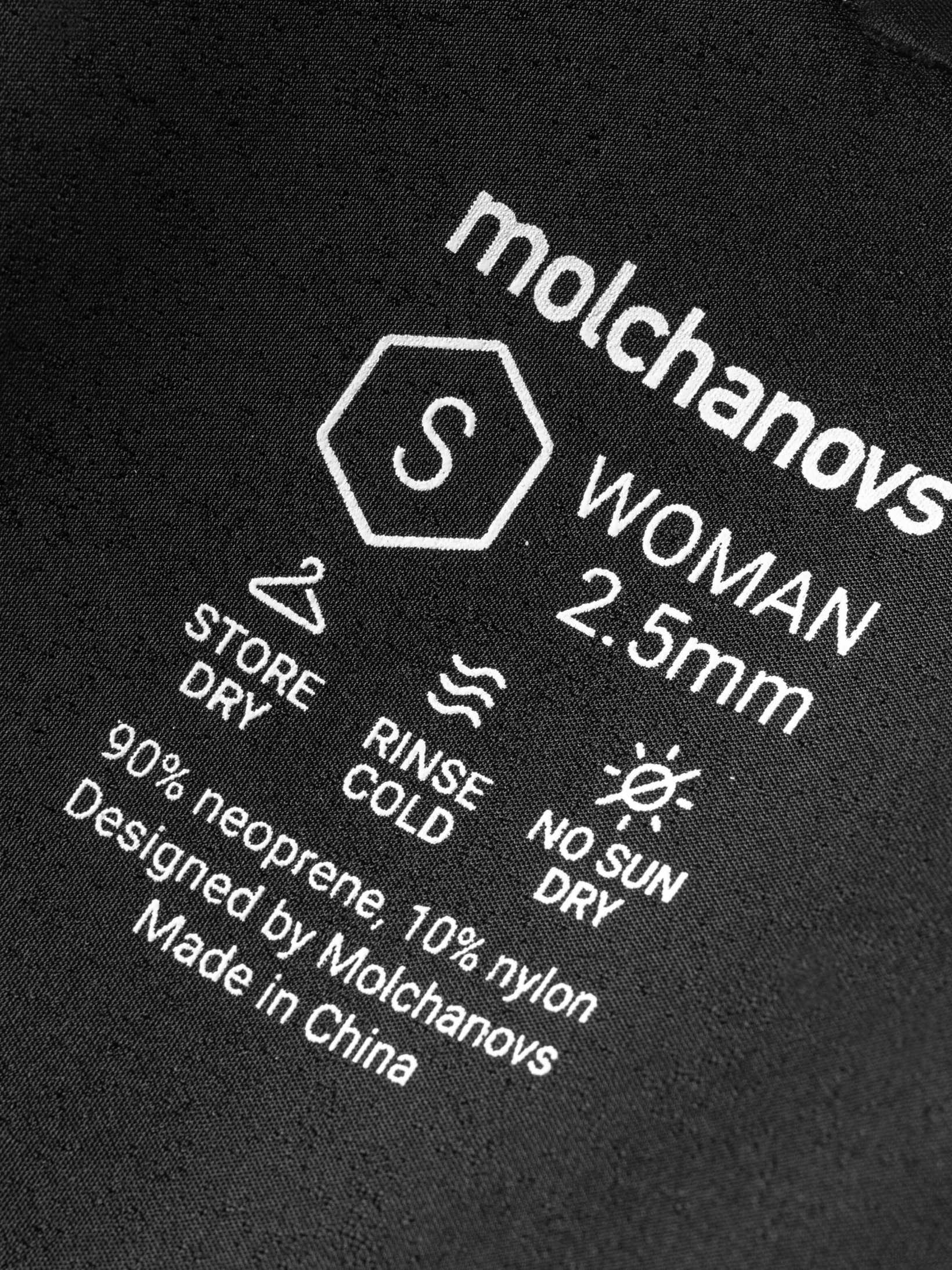 Close up of sizing, neoprene thickness and care instruction for this ladies wetsuit