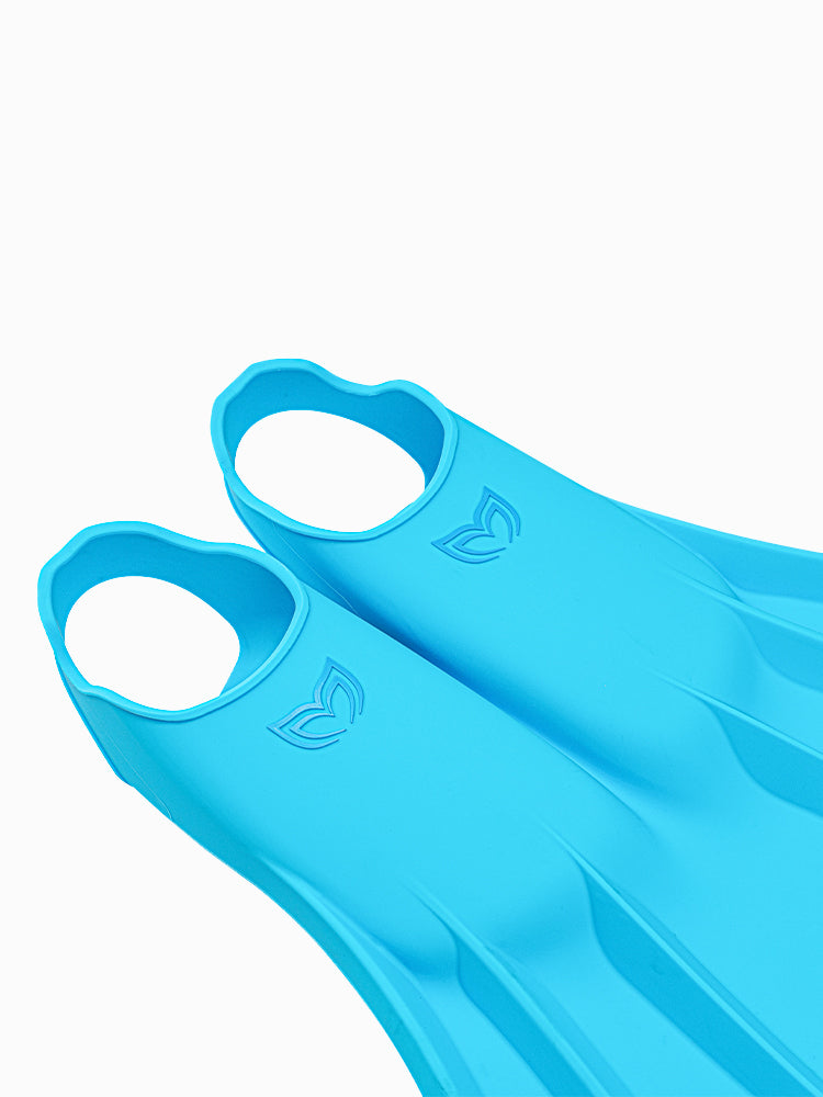 Close-up of Molchanovs CORE Silicone Monofin foot pockets in blue, showing ergonomic opening and Molchanovs logo