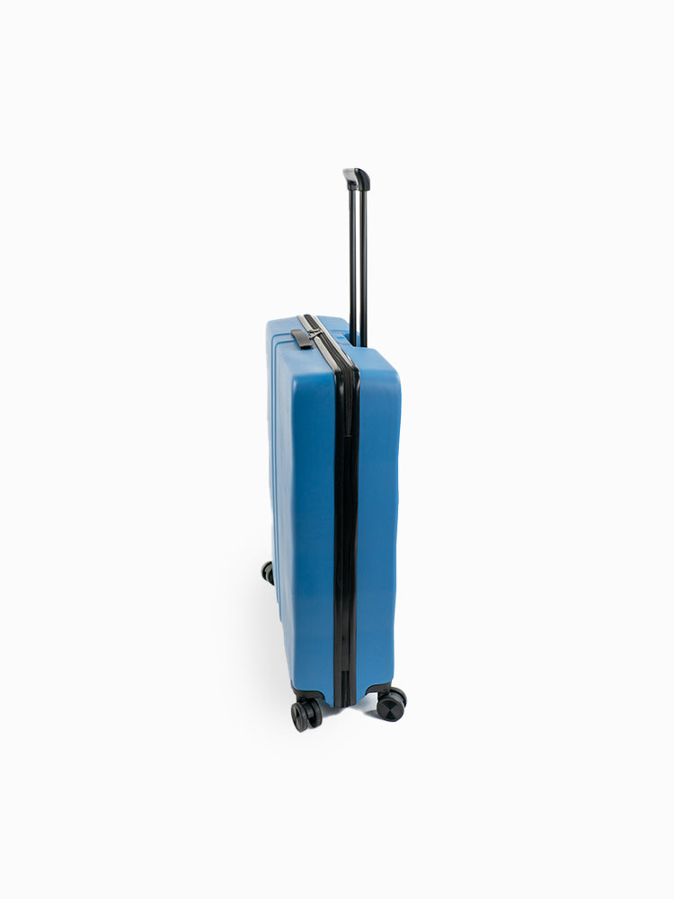 Molchanovs freediving hard case in blue, side view showing zipper closure and four spinner wheels