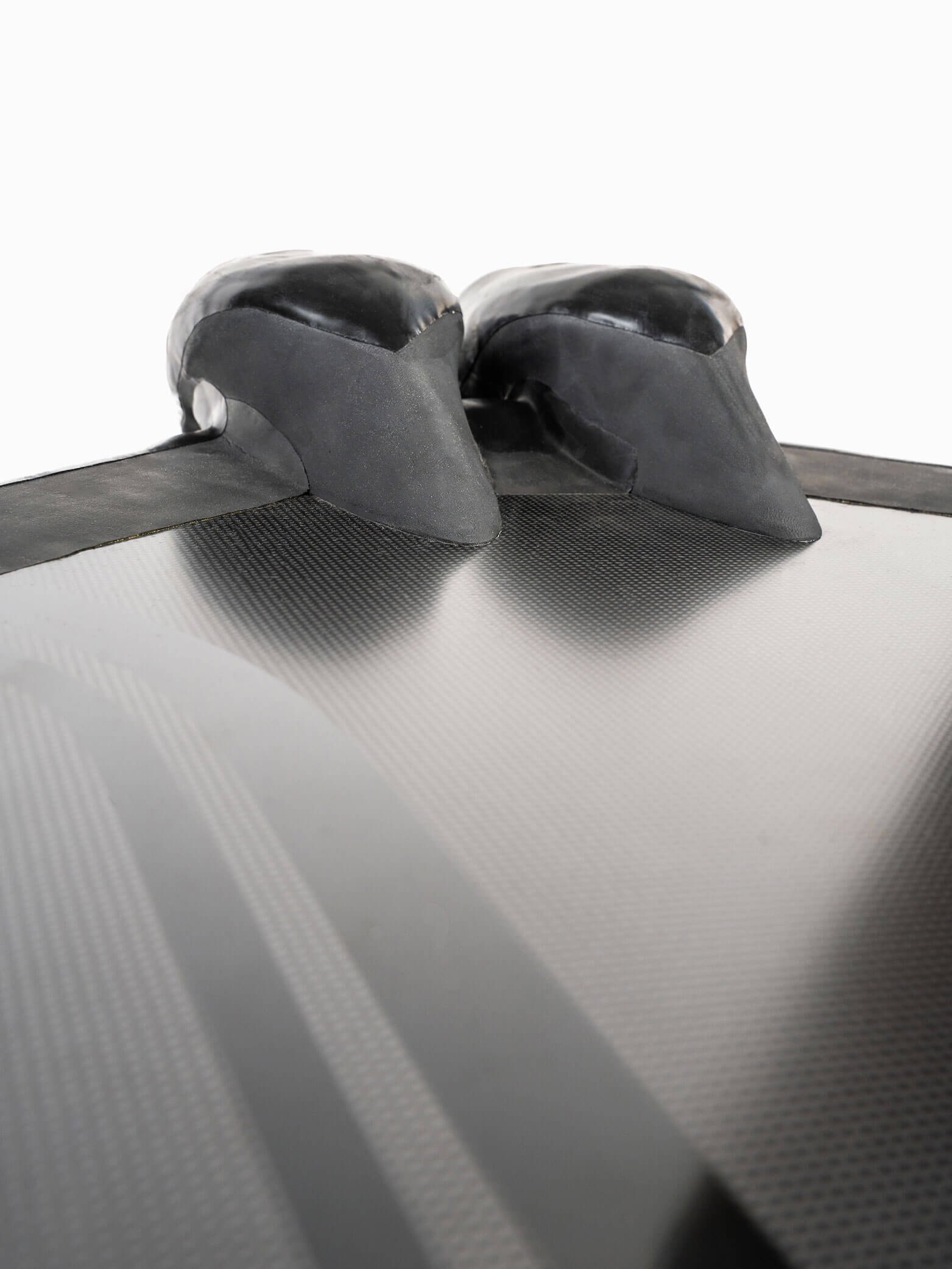 Close-up of the PRO Monofin 4X Carbon blade surface and rubber foot pocket attachment point