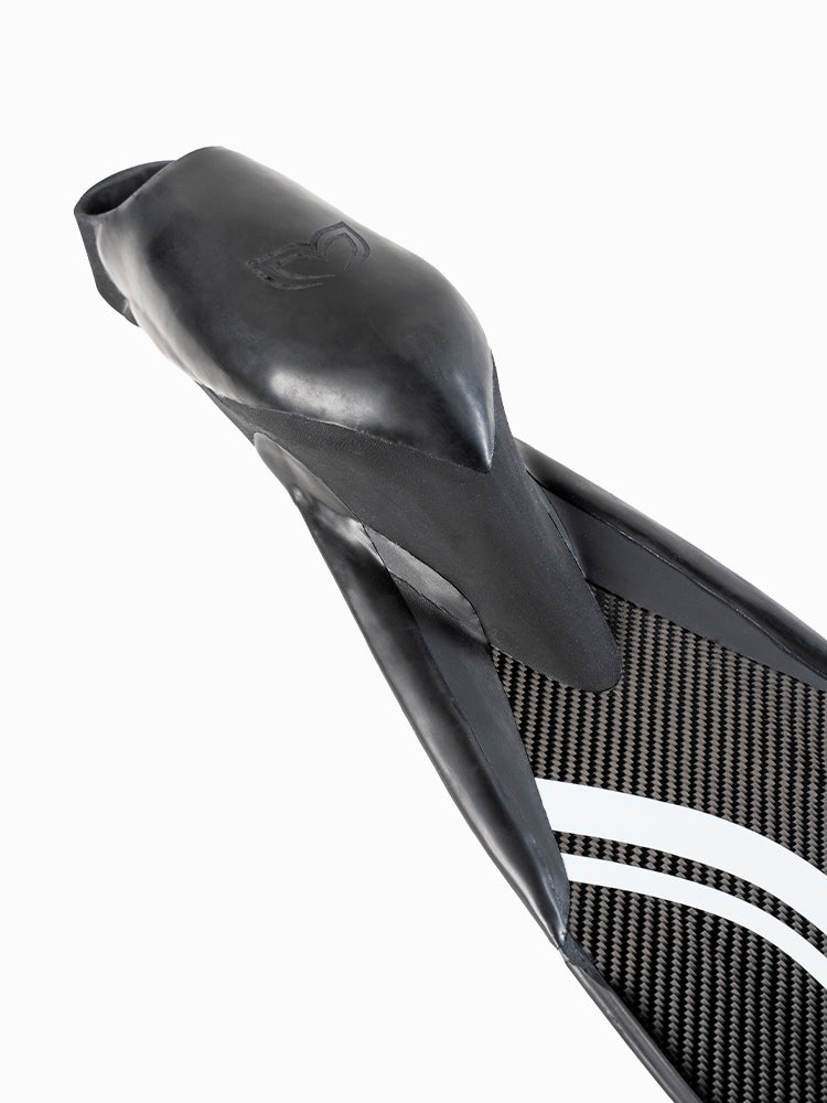 Close-up of the PRO Hyper Carbon Bifins foot pocket showing the monofin-derived rubber design and carbon fiber blade connection