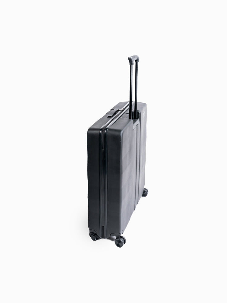 Molchanovs freediving hard case in black, side view showing depth and spinner wheels