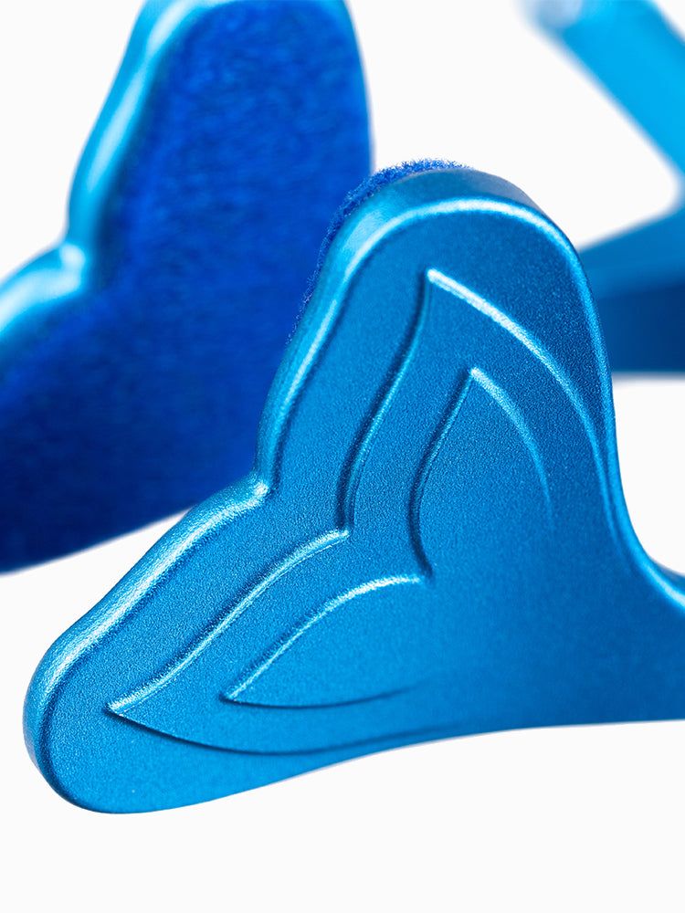 Close-up of the Molchanovs A6063x nose clip wing and velvet pad in anodized blue, showing the engraved logo detail
