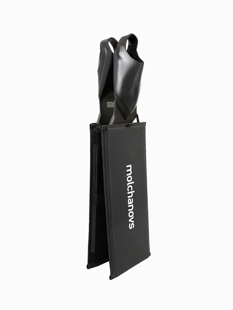Molchanovs bifin blade protectors standing upright with fin foot pockets visible above the cover, showing travel-ready fit
