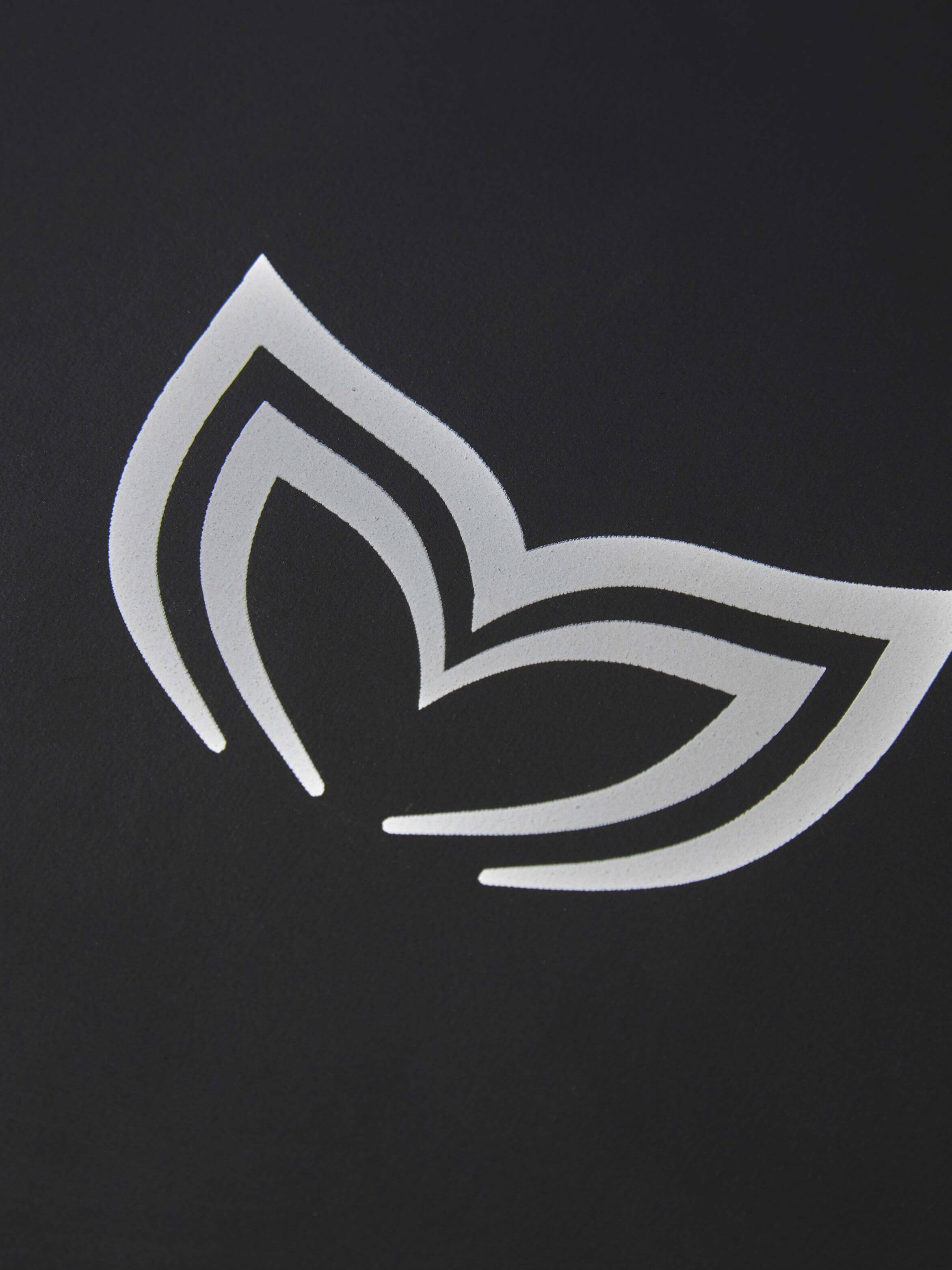 Close-up of the Molchanovs logo embossed on the chest of the PRO unlined wetsuit neoprene