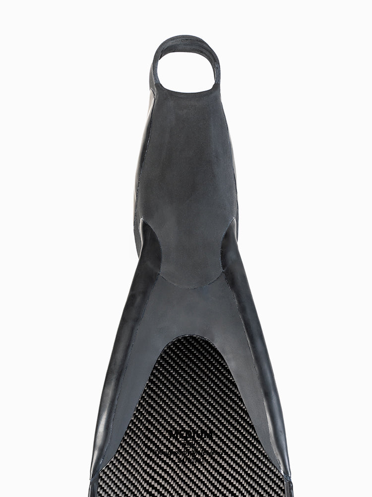 Top-down view of the PRO Hyper Carbon Bifins foot pocket showing the open-heel loop and carbon fiber blade surface