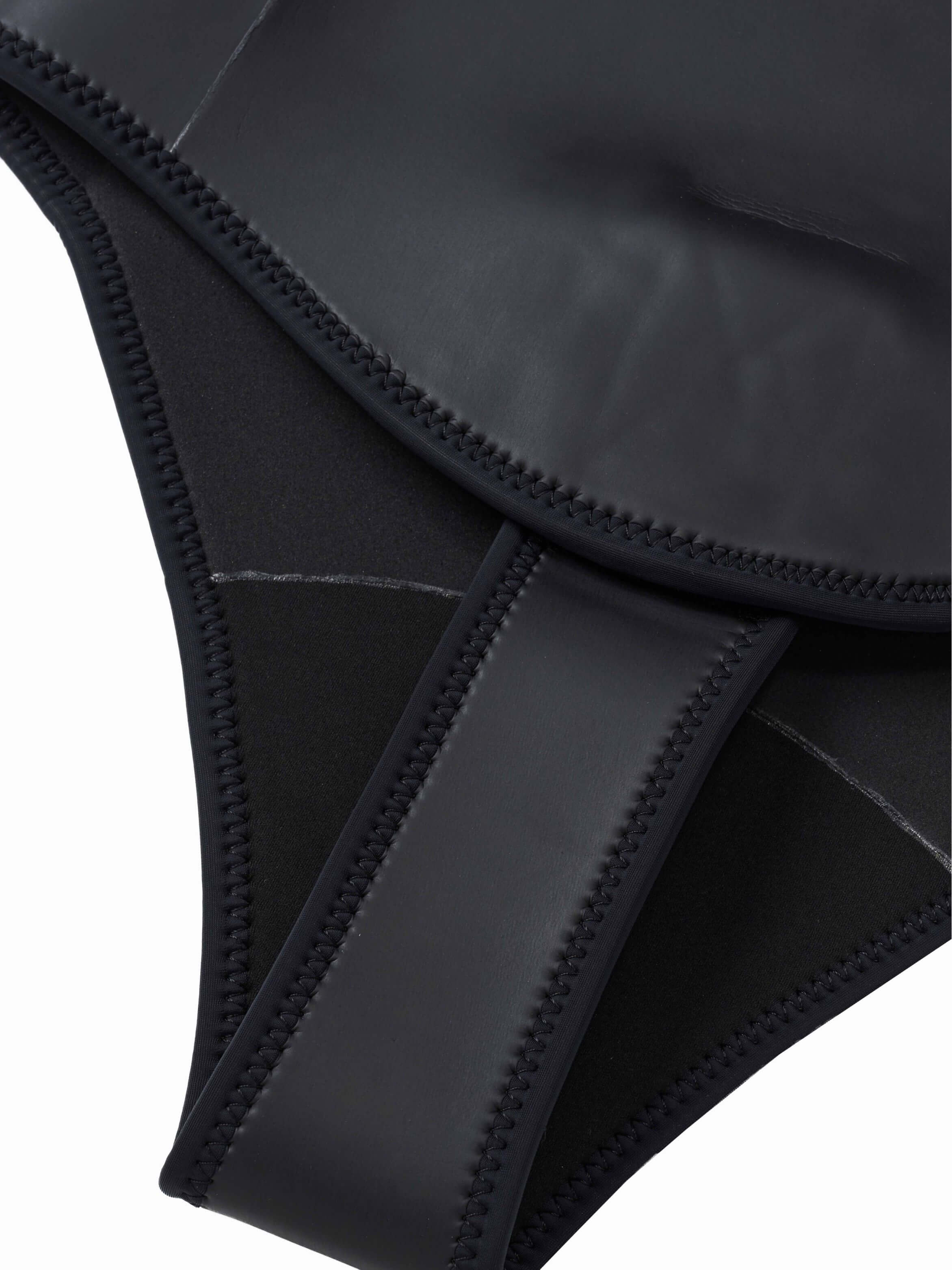 Crotch panel detail of the Molchanovs PRO unlined wetsuit showing smooth-skin neoprene and overlock stitching