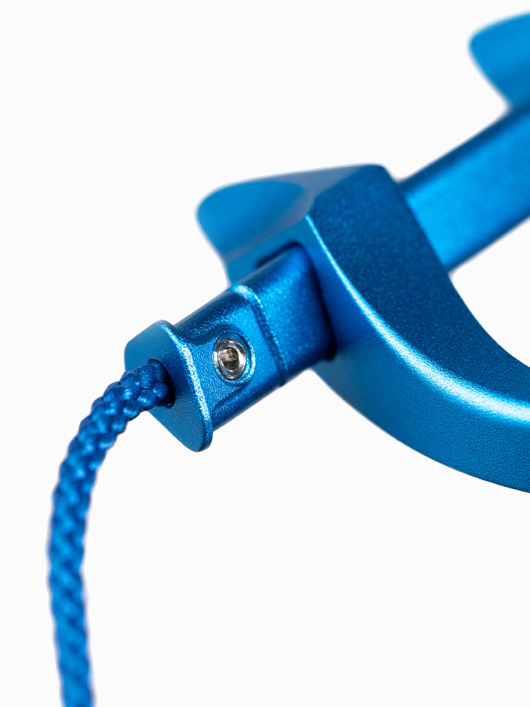 Close-up of the A6063x nose clip lanyard attachment point showing the machined aluminum pivot and braided cord connection