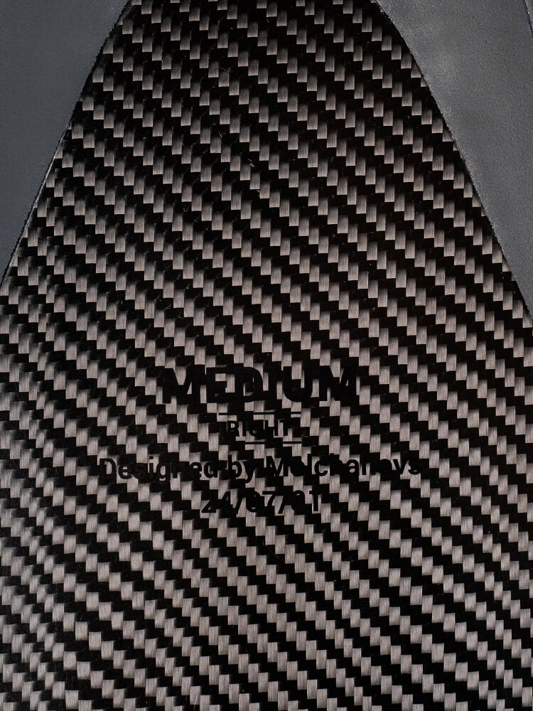 Carbon fiber blade surface of a PRO Hyper Bifin showing woven texture and laser-engraved size and Designed by Molchanovs markings