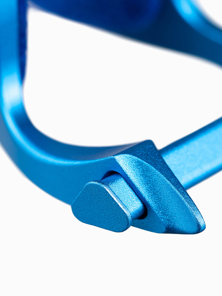 Macro view of the A6063x nose clip clamping tips in blue anodized aluminum, showing the rubber contact pads