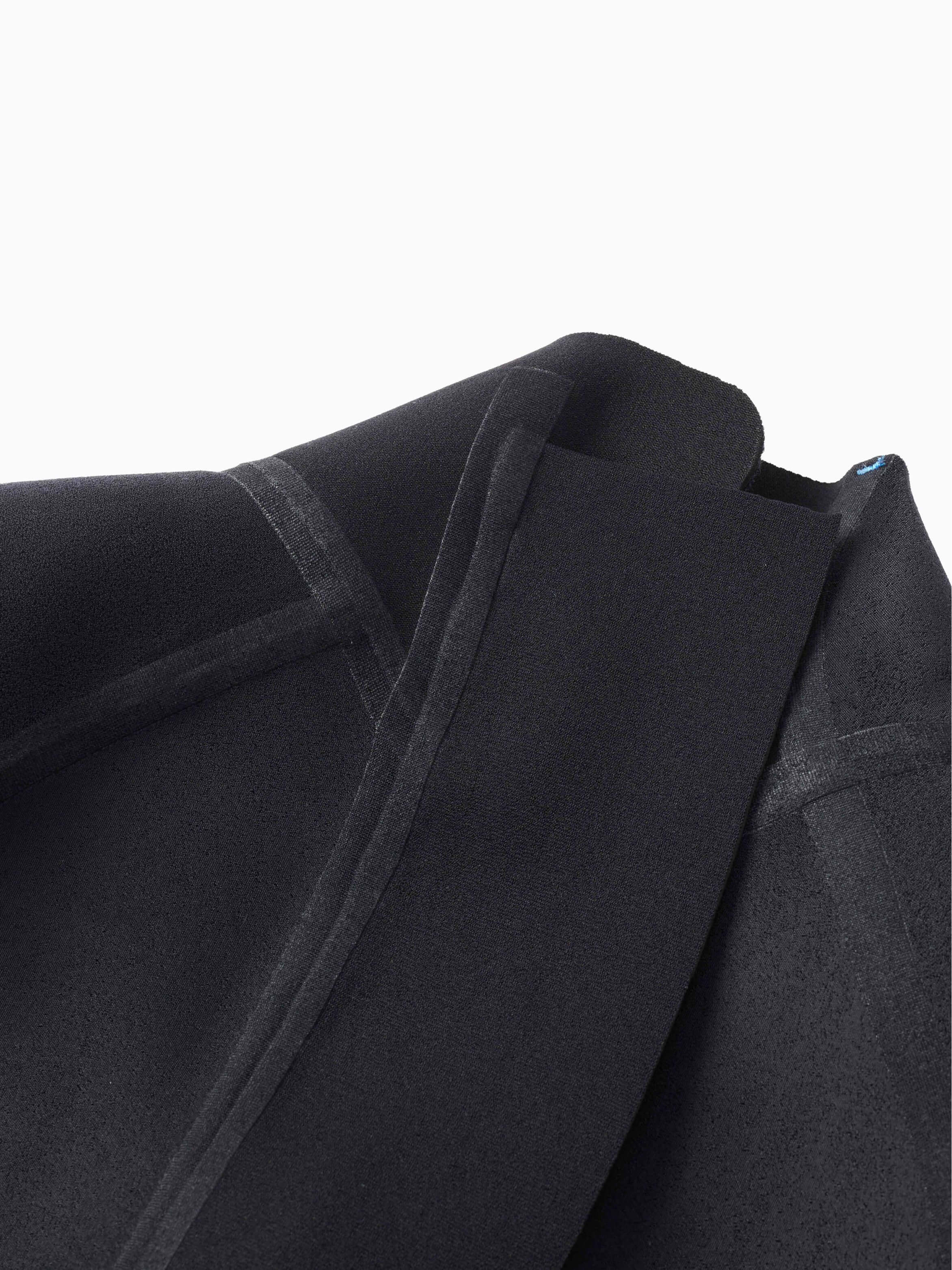 Interior neoprene lining of the Molchanovs SPORT wetsuit, showing the soft fabric inside layer and flatlock seams
