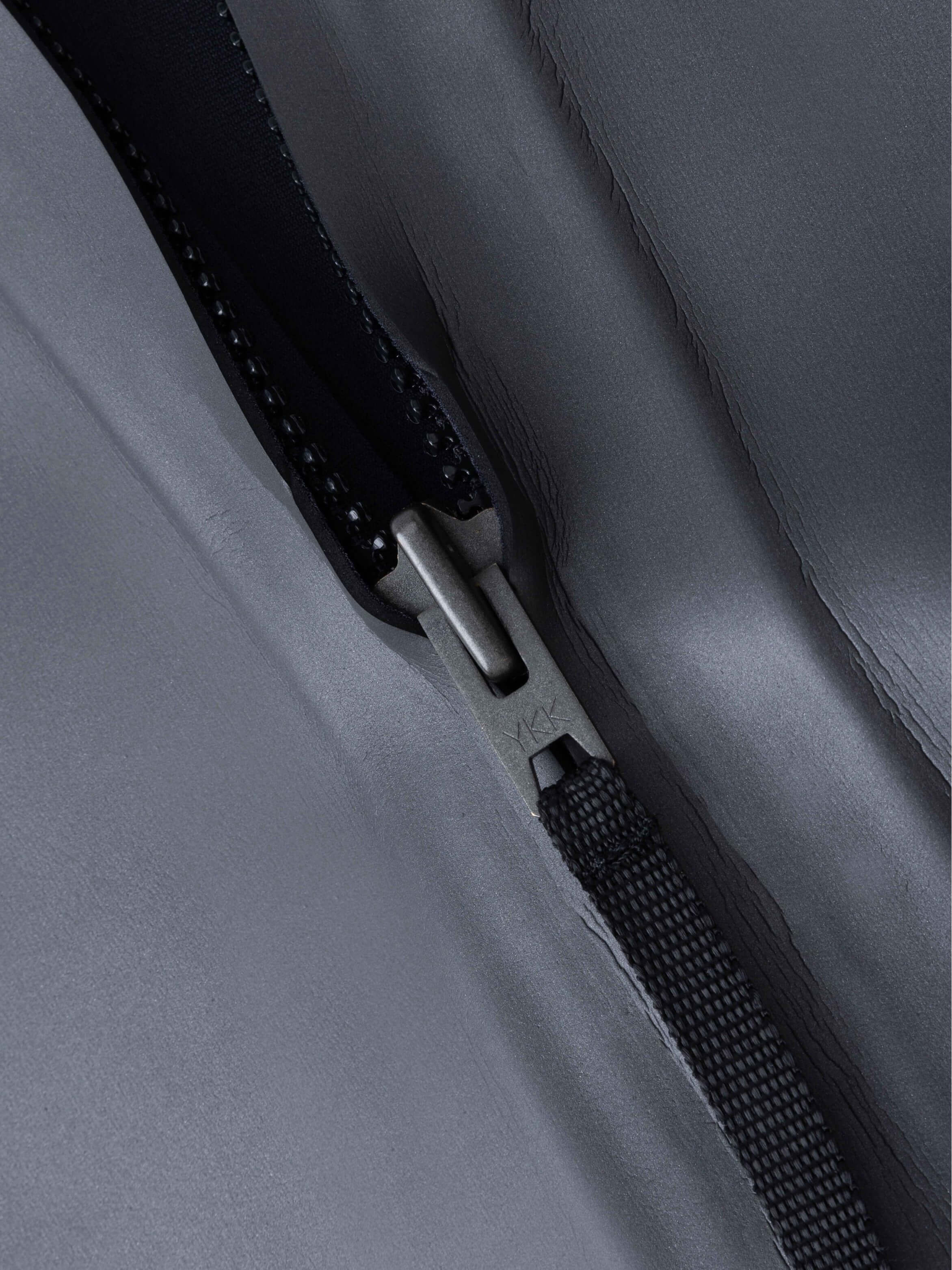 Close-up of the metal zipper pull on the Molchanovs PRO women's one-piece wetsuit back entry