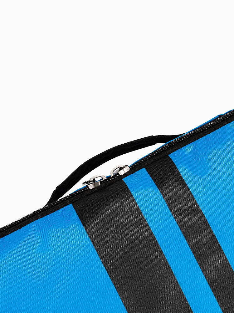 Close-up of the Molchanovs monofin bag top edge showing the zipper opening and fabric carry handle in blue