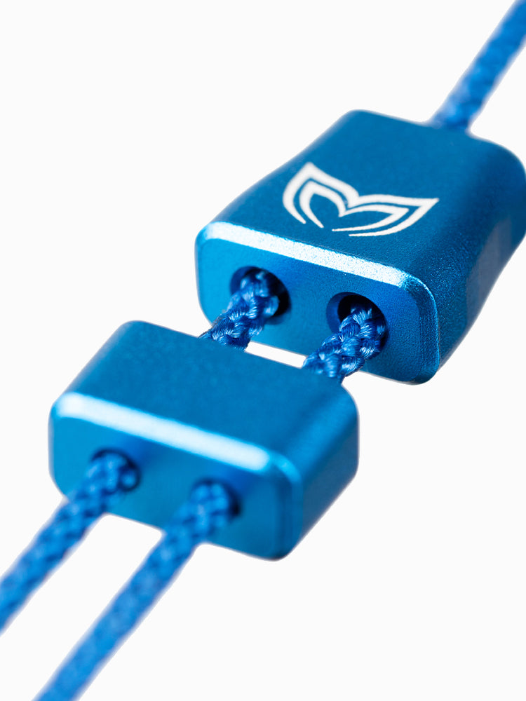 Close-up of the A6063x nose clip cord lock in anodized blue aluminum with Molchanovs logo and dual-hole lanyard adjustment