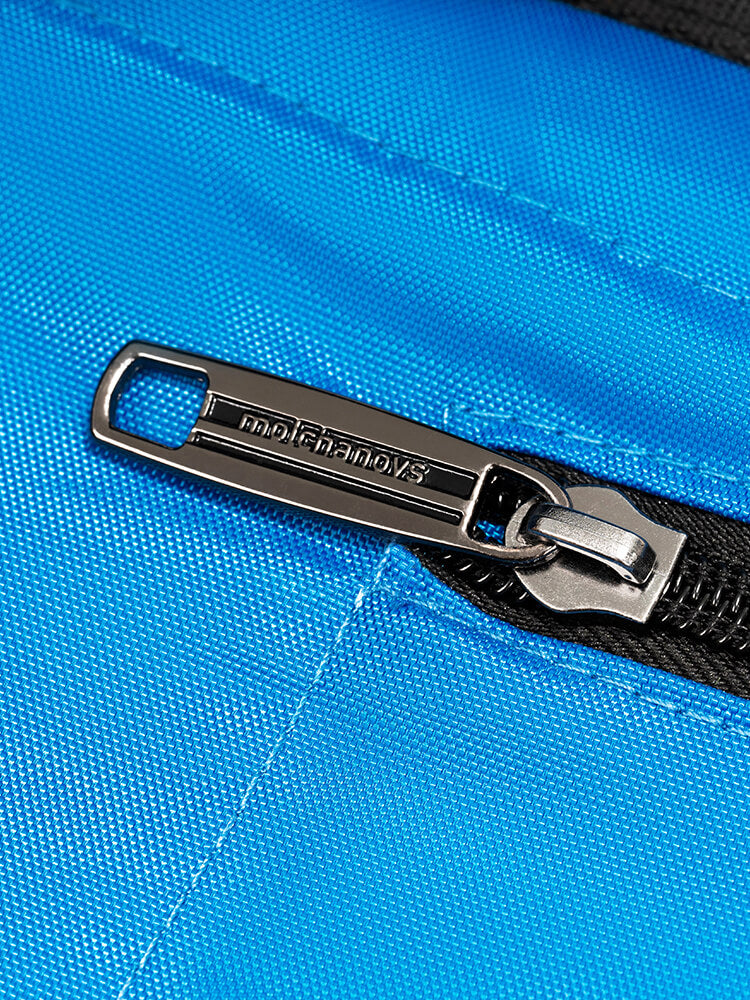 Close-up of the branded Molchanovs metal zipper pull on the blue monofin bag showing logo engraving
